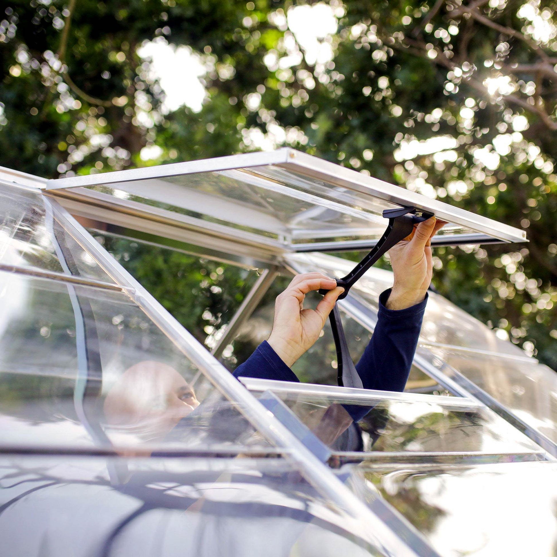 An opening air vent on a greenhouse