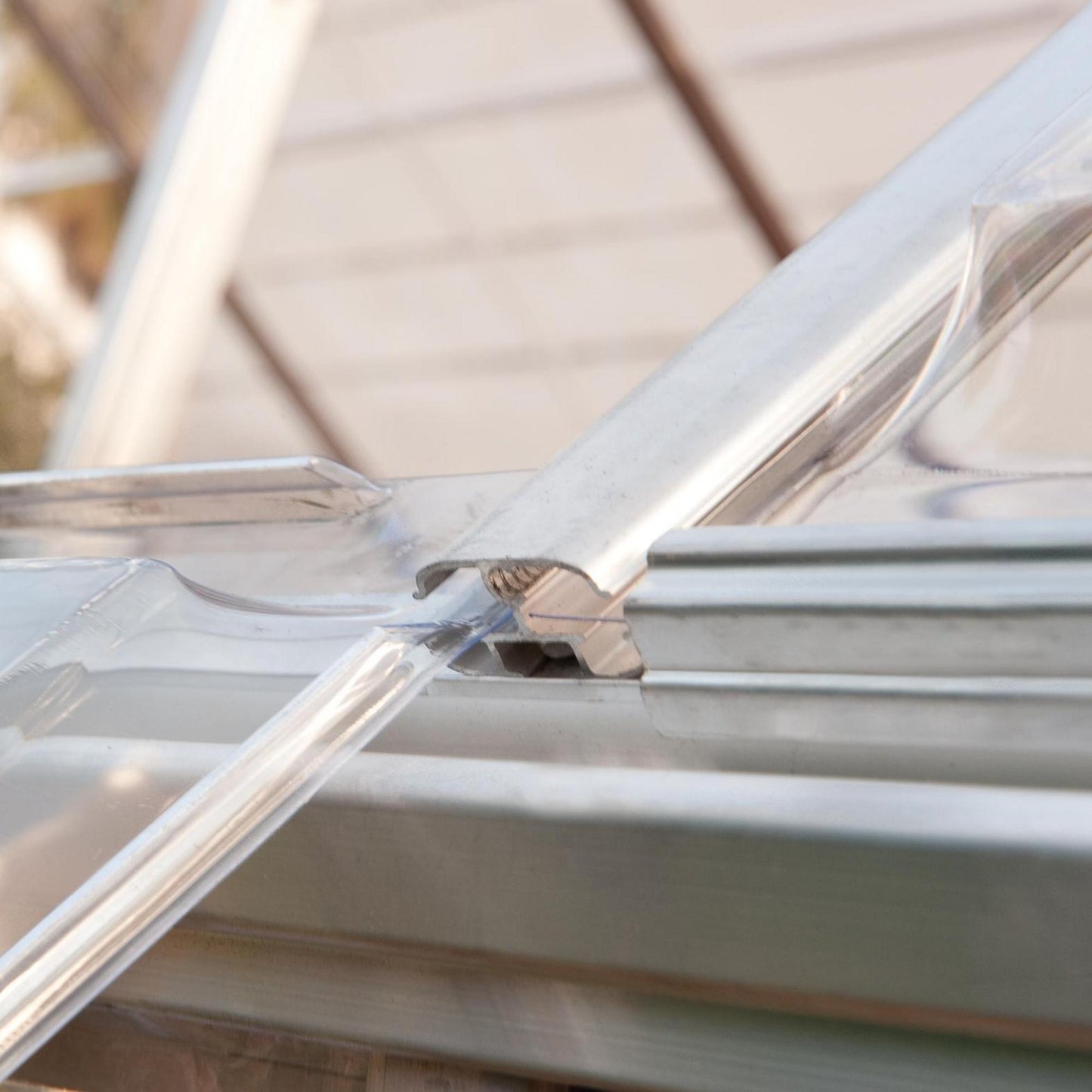 Sliding panels on a silver metal greenhouse