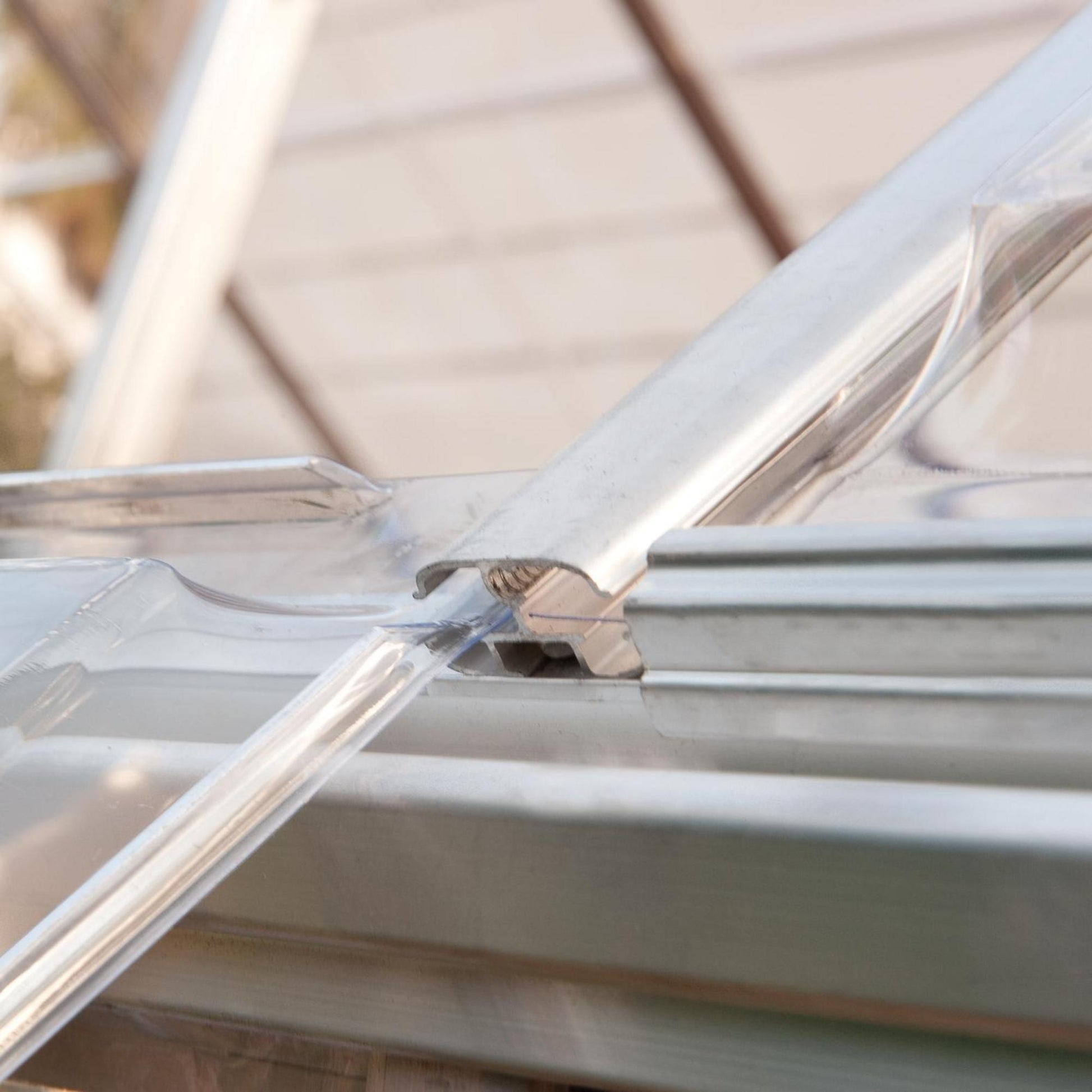 Sliding panels on a silver metal greenhouse