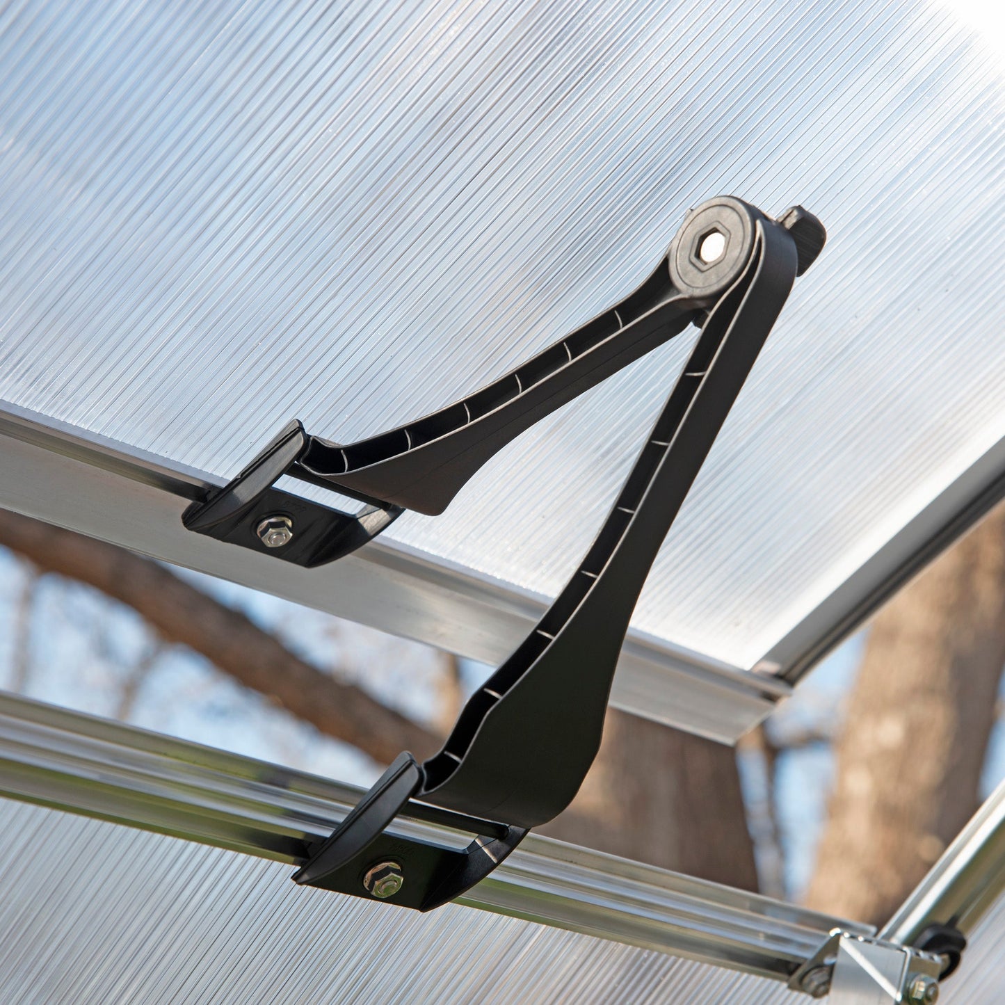 An opening air vent on a greenhouse