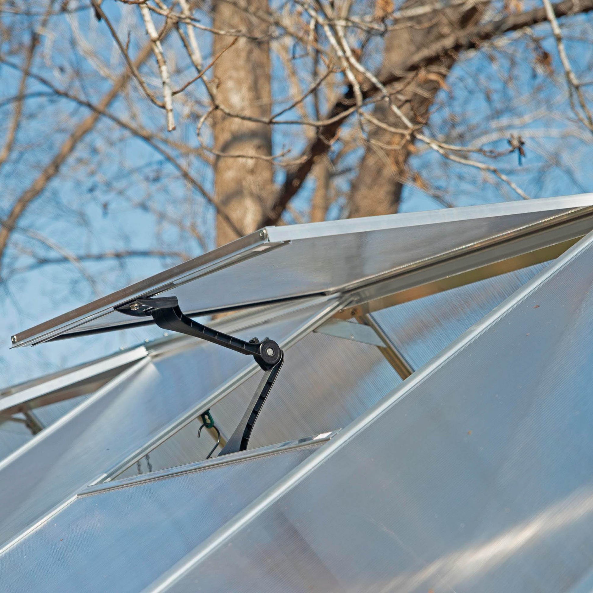 An opening air vent on a greenhouse