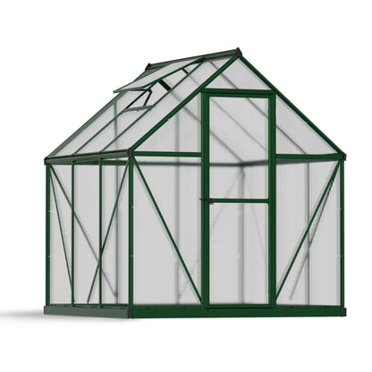 A greenhouse with textured windows and green metal framing