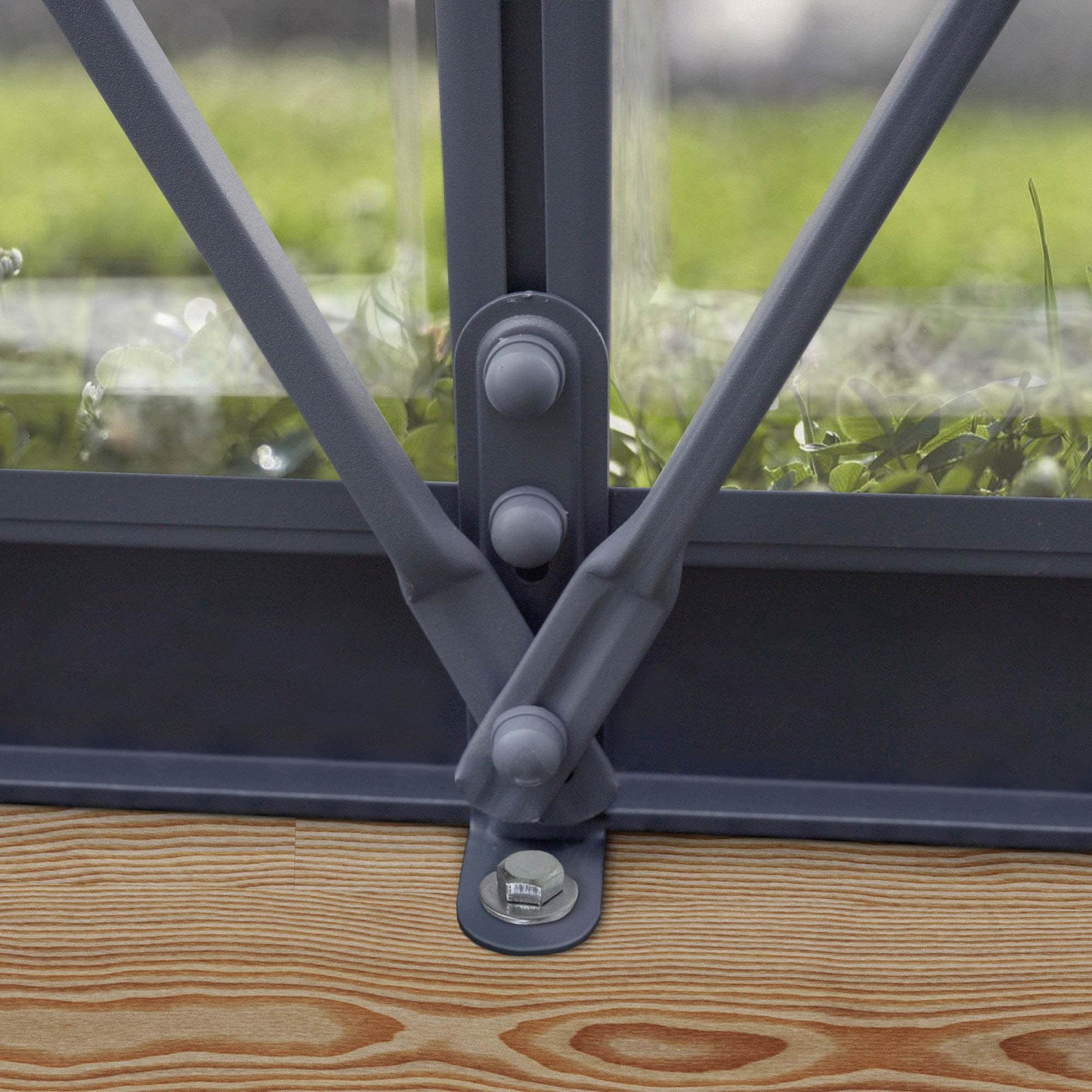 Anchoring kit on a grey metal greenhouse