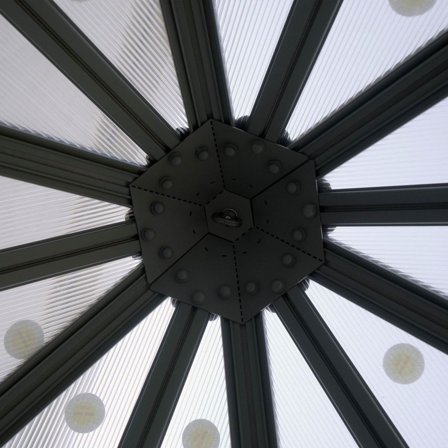 A hanging ring on the roof on a hexagonal greenhouse