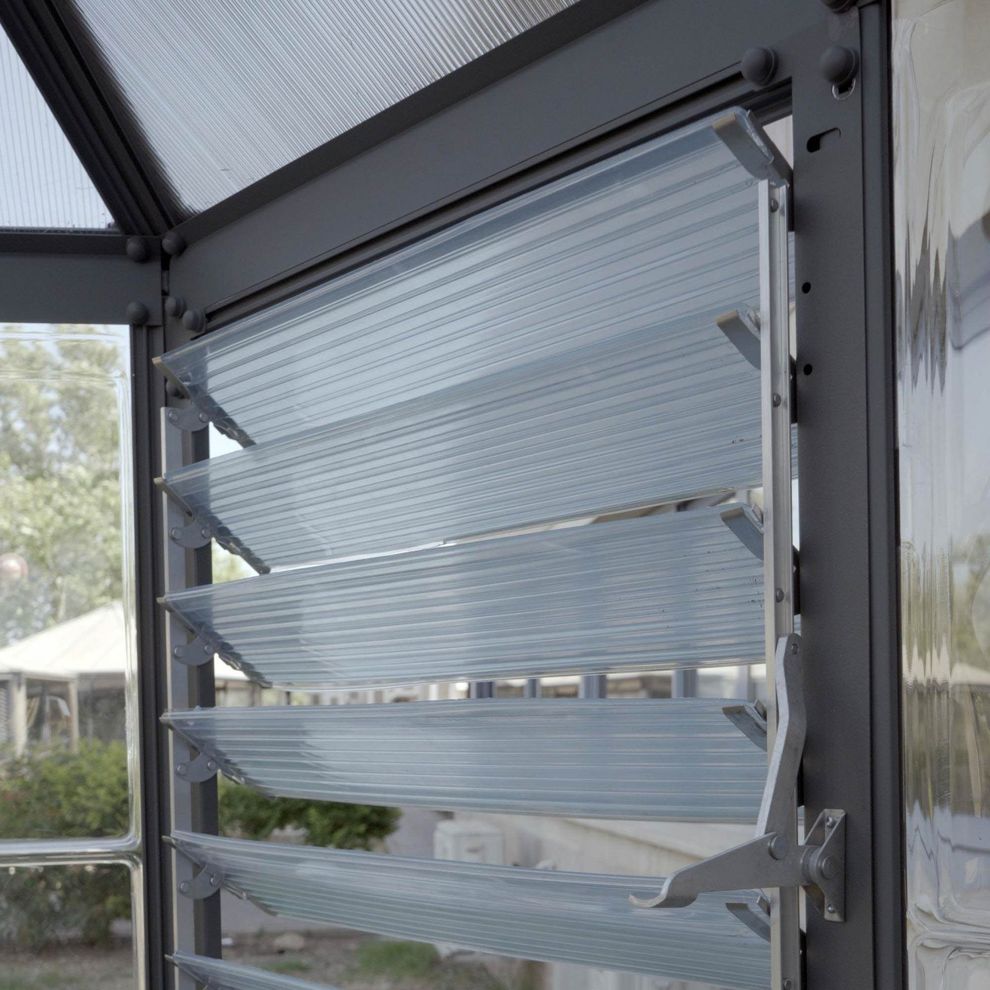 An opening air vent on a greenhouse