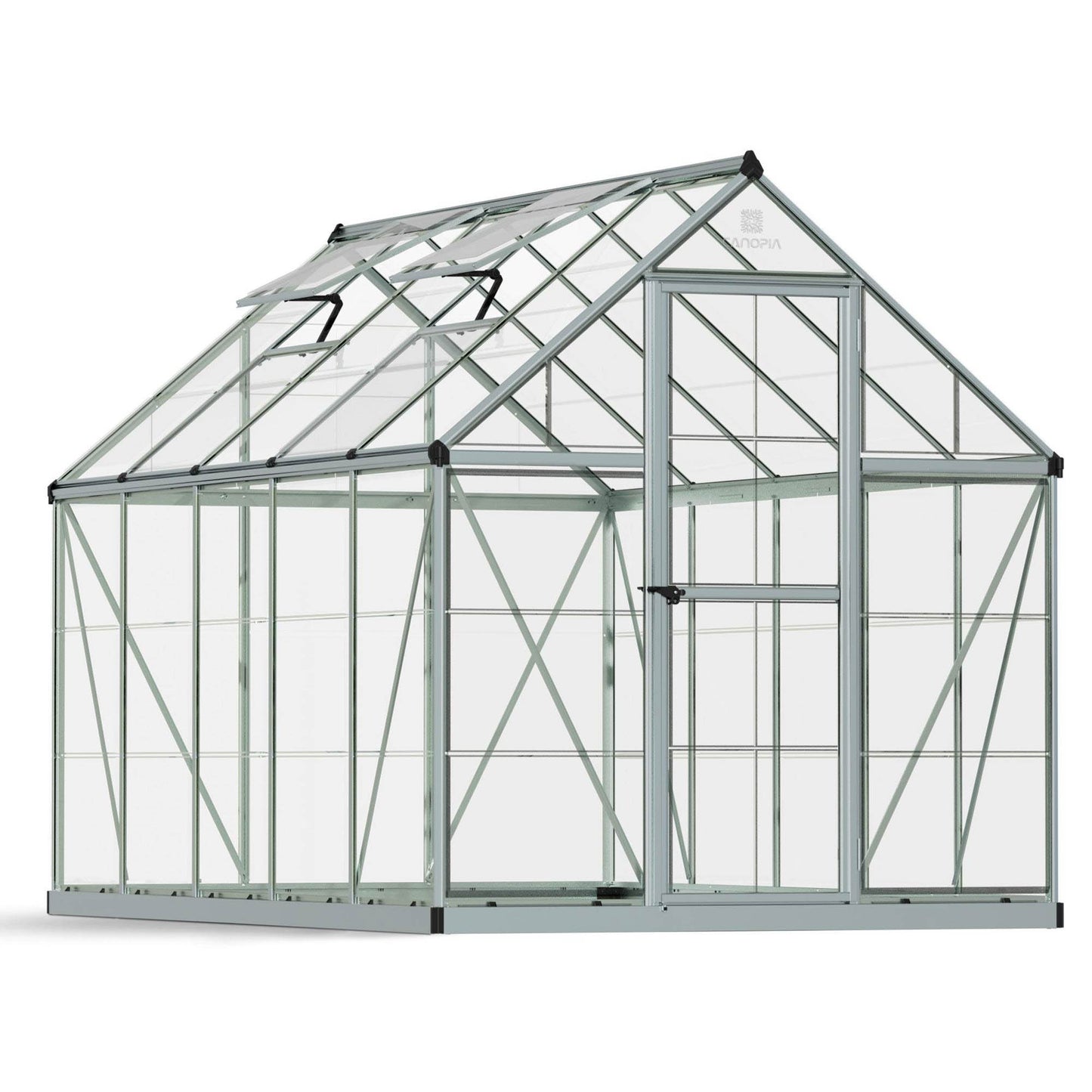 A greenhouse made up of windows with silver metal framing