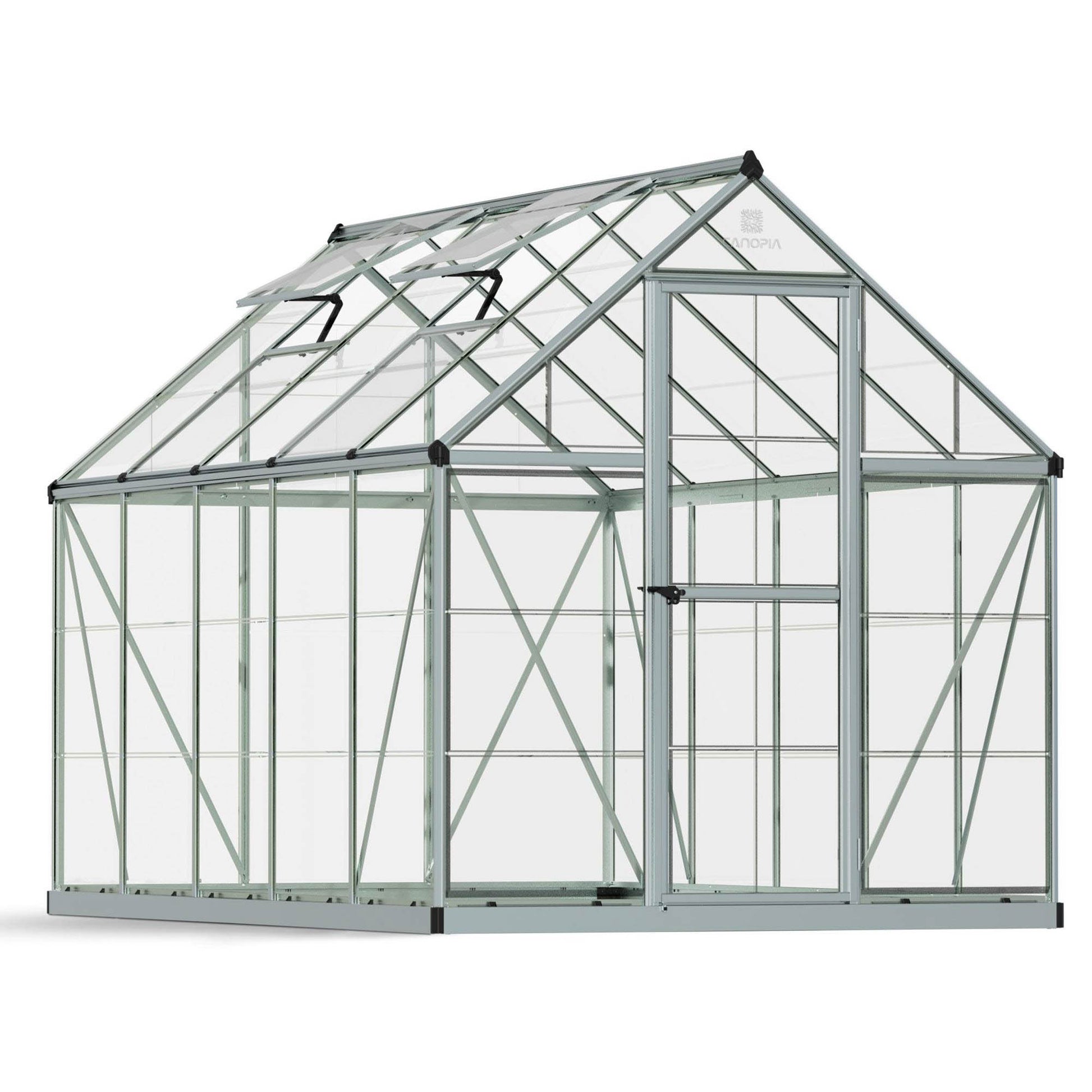A greenhouse made up of windows with silver metal framing